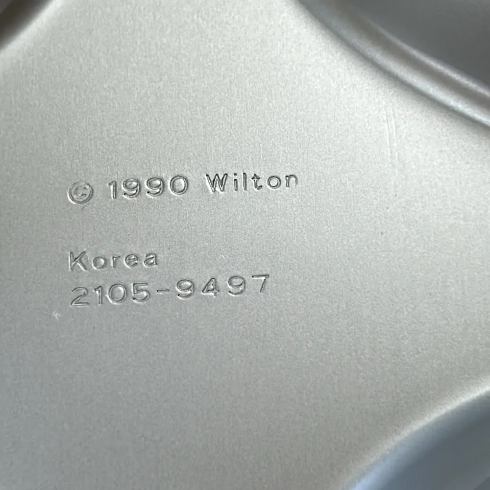 Wilton 4 in 1 Jack-O-Lantern Halloween theme molds/cake pans.  Dated 1990.